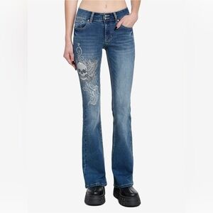 Hot topic winged Y2K skull cross flare denim jeans